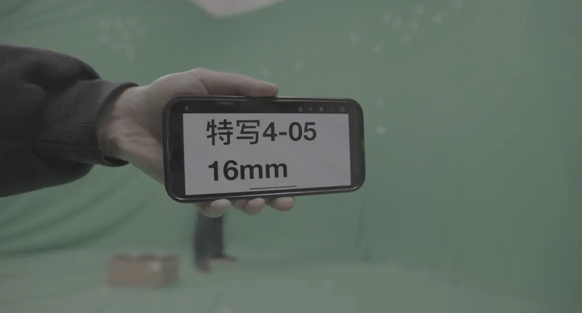 Phone used as a slate reading 特写4-05 16mm in a green screen studio